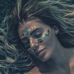 Metallic Feathers Tattoos